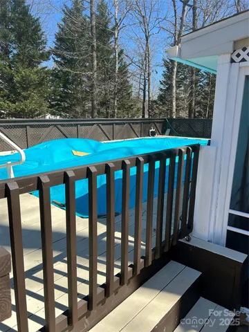 a view of a patio with a table chairs and a backyard