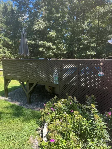 a view of a chair and table in the balcony
