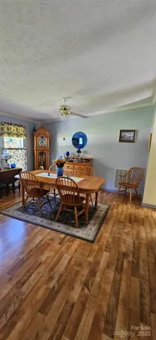 a dining room with a table and chairs