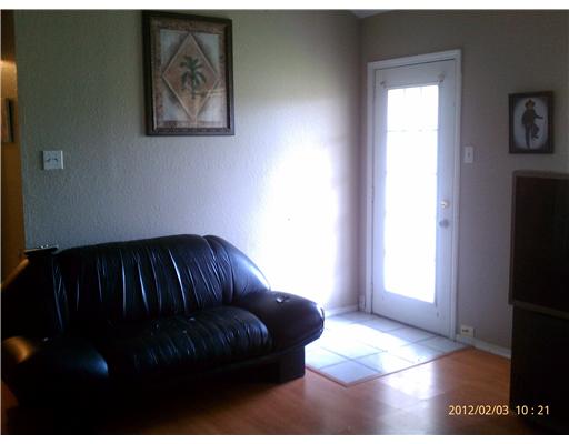123 Dell Street Portland, TX 78374 - Photo 3 of 10 a living room with furniture and a window