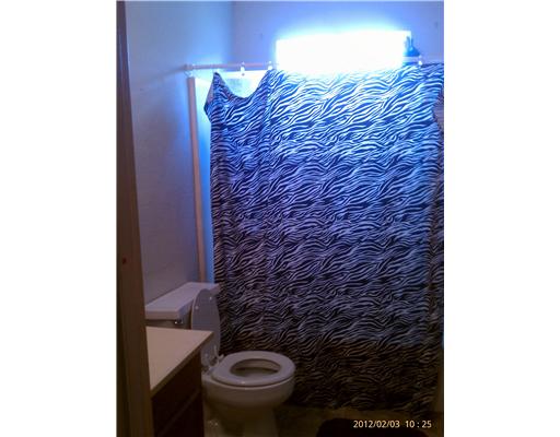 123 Dell Street Portland, TX 78374 - Photo 6 of 10 a bathroom with a toilet and a sink