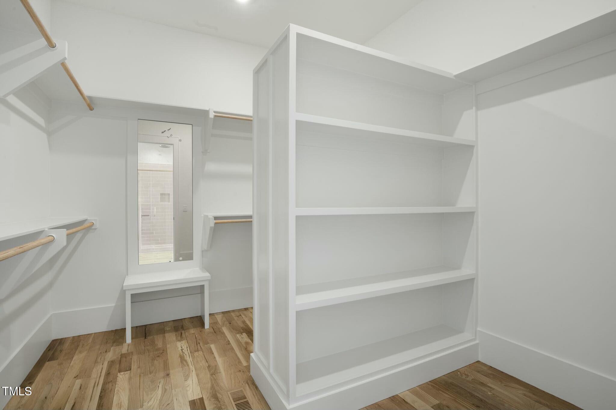 7112 Camp Side Court Raleigh, NC 27613 - Photo 20 of 39 a room that has a bed and a table in it