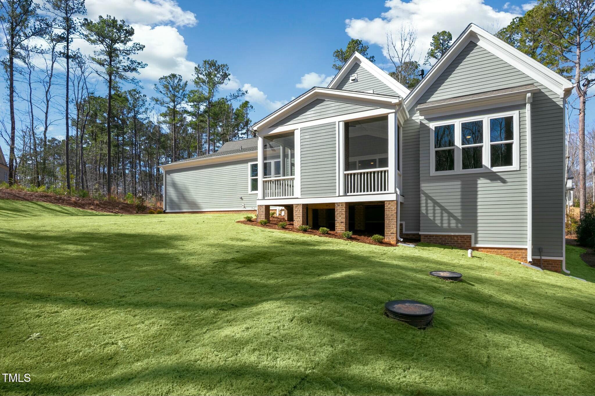 7112 Camp Side Court Raleigh, NC 27613 - Photo 3 of 39 a view of a house with a yard