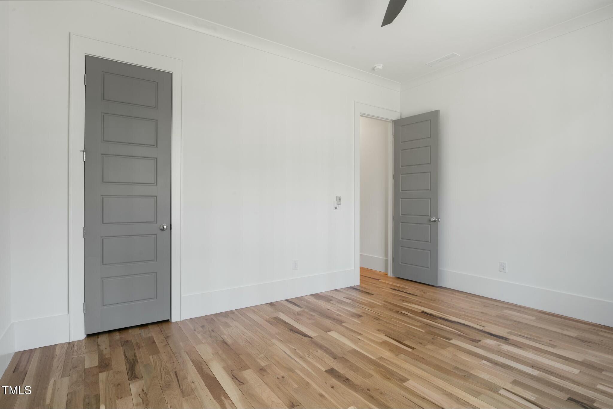 7112 Camp Side Court Raleigh, NC 27613 - Photo 31 of 39 a view of empty room with wooden floor