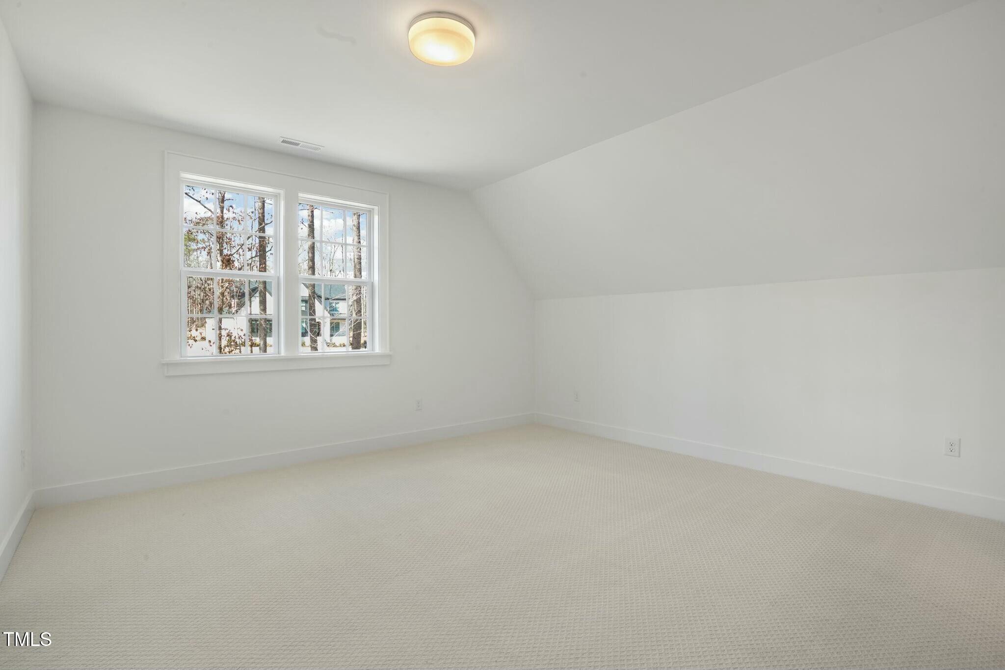 7112 Camp Side Court Raleigh, NC 27613 - Photo 39 of 39 an empty room with windows