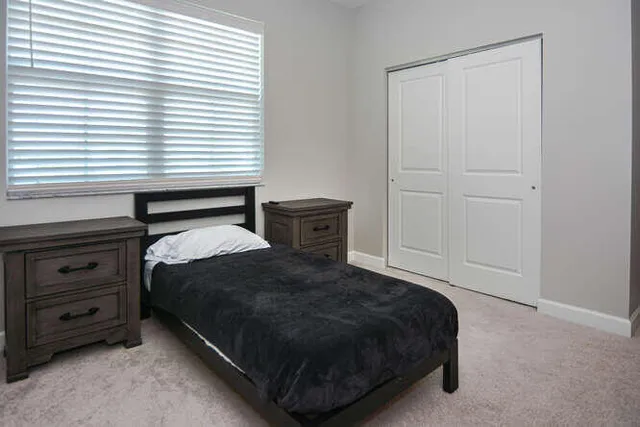 a view of a house with backyard and porch