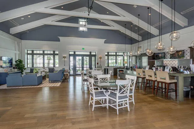 a view of a livingroom with furniture window and wooden floor