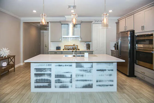 a kitchen with a sink and cabinets
