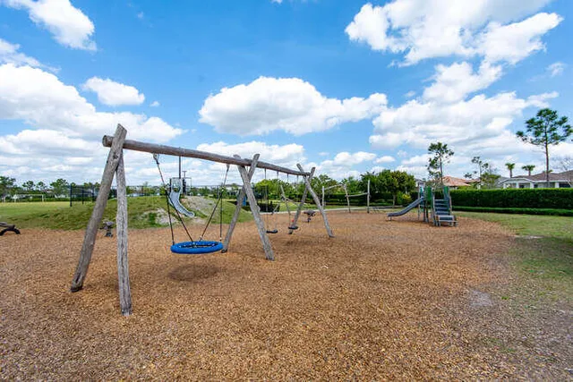 a front view of a house with table and chairs