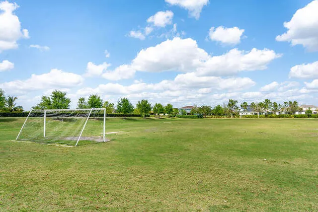 a childrens park with lots of swings and slides