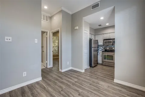 a view of a kitchen from the hallway
