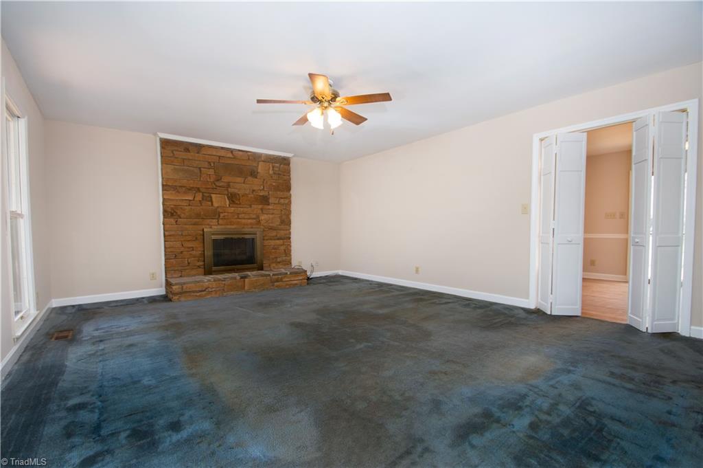 7011 Aplington Road Oak Ridge, NC 27310 - Photo 4 of 27 Main Floor Den With Wood Burning Fireplace