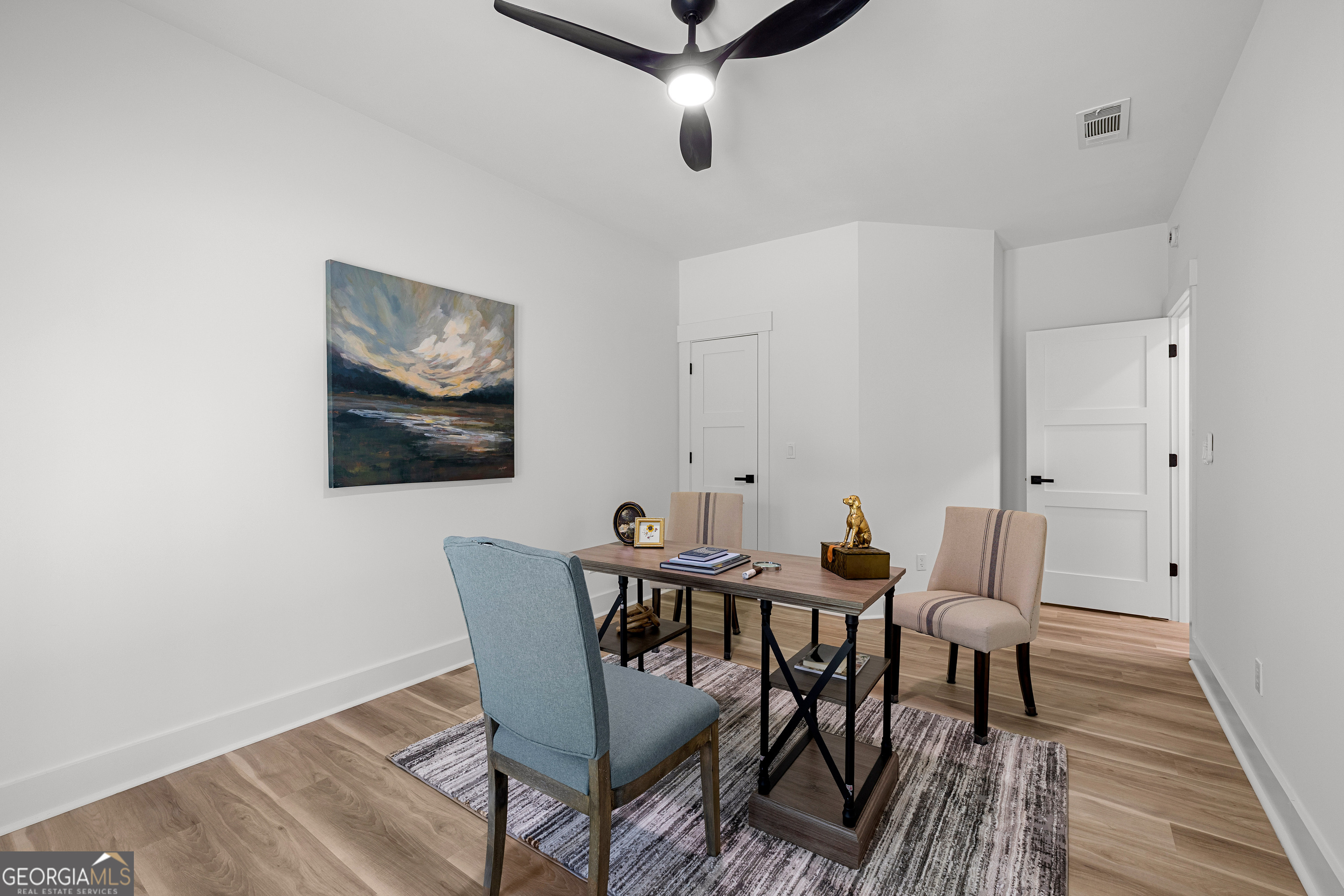 354 Turner Road Newnan, GA 30263 - Photo 56 of 79 a view of a dining room with furniture and wooden floor