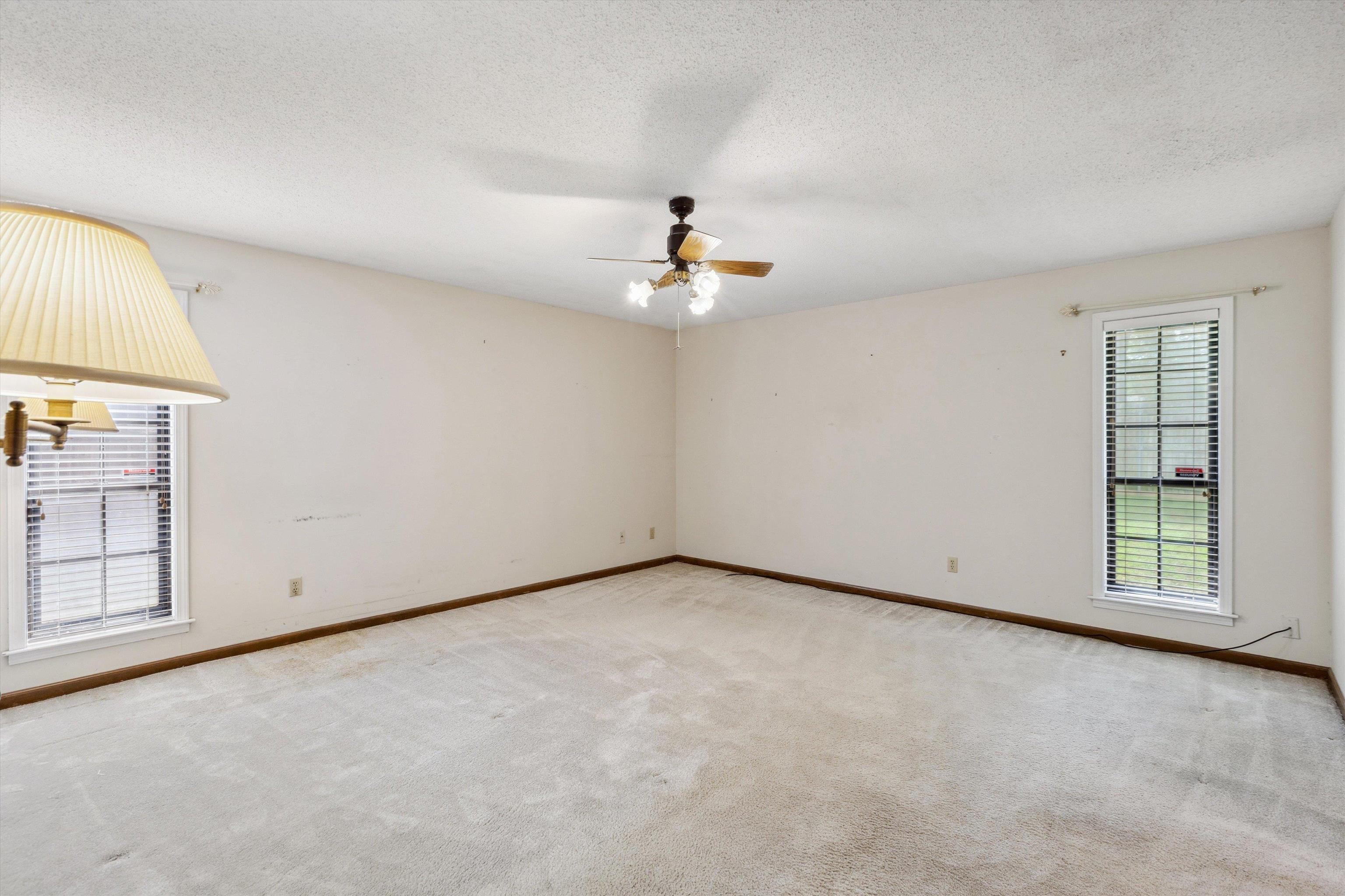 5973 Explorer Road Bartlett, TN 38134 - Photo 20 of 35 an empty room with windows and ceiling fan