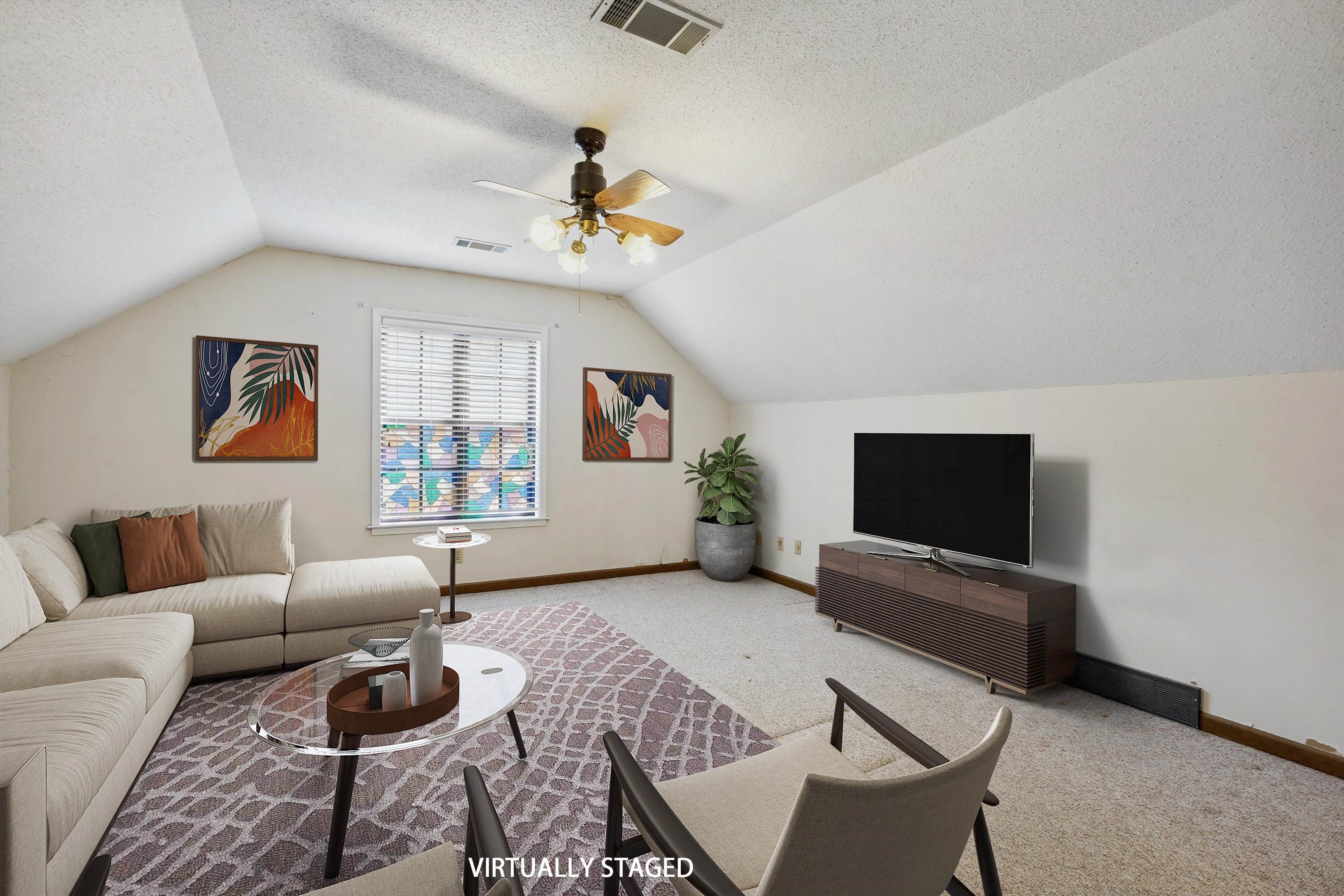 5973 Explorer Road Bartlett, TN 38134 - Photo 26 of 35 a living room with furniture a flat screen tv and a window