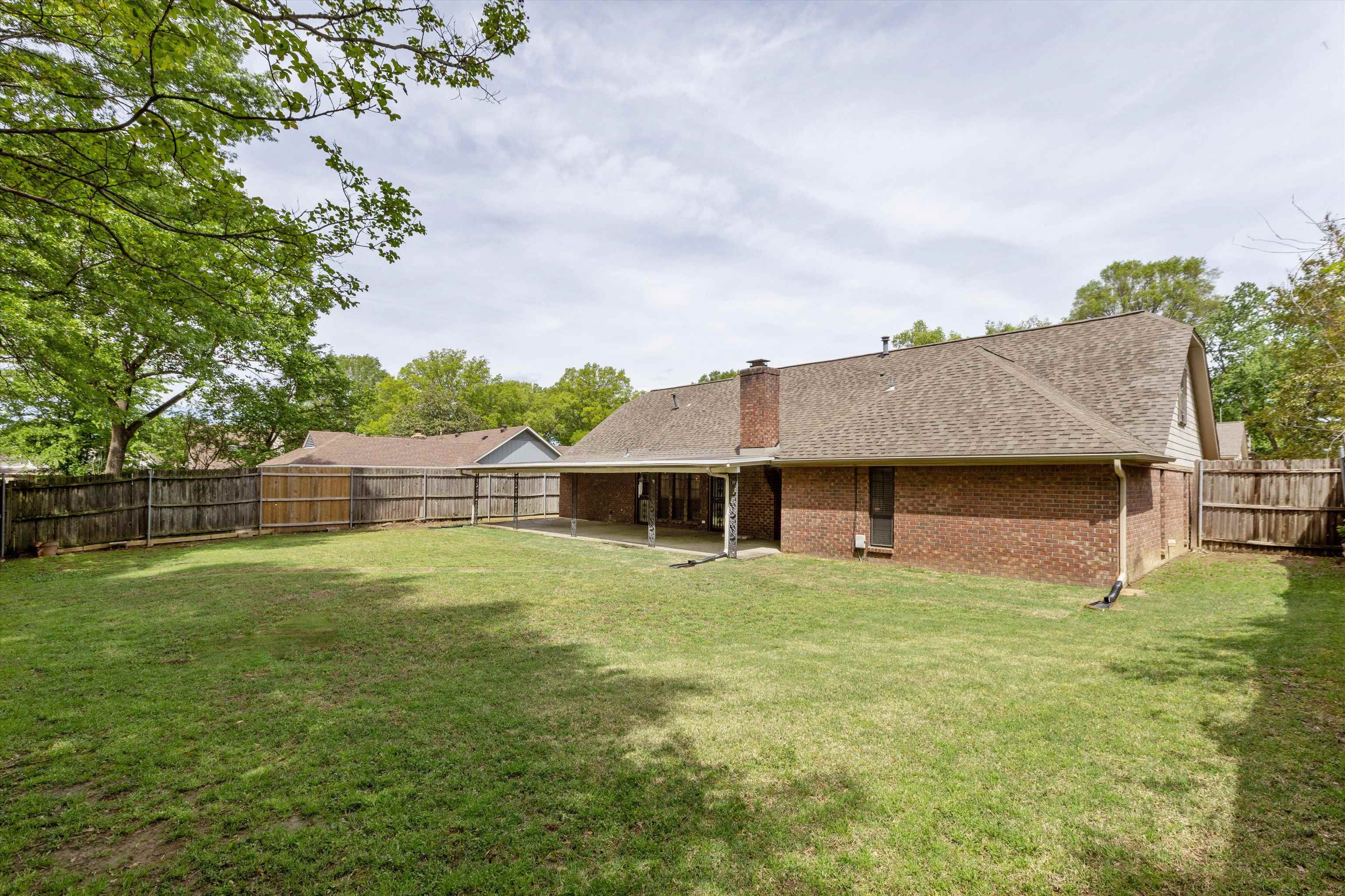 5973 Explorer Road Bartlett, TN 38134 - Photo 32 of 35 a front view of house with yard and trees