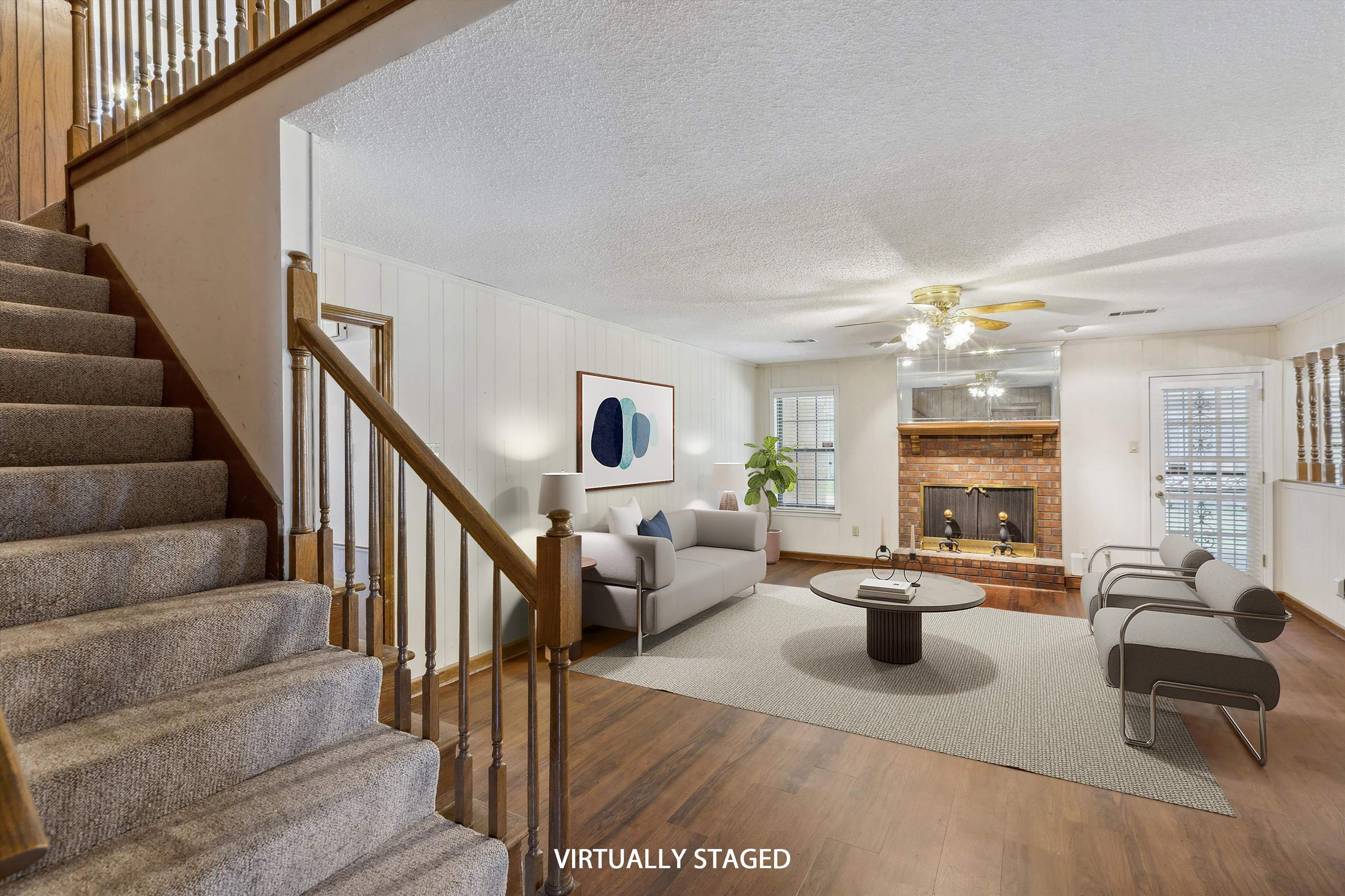 5973 Explorer Road Bartlett, TN 38134 - Photo 4 of 35 a living room with furniture and a chandelier
