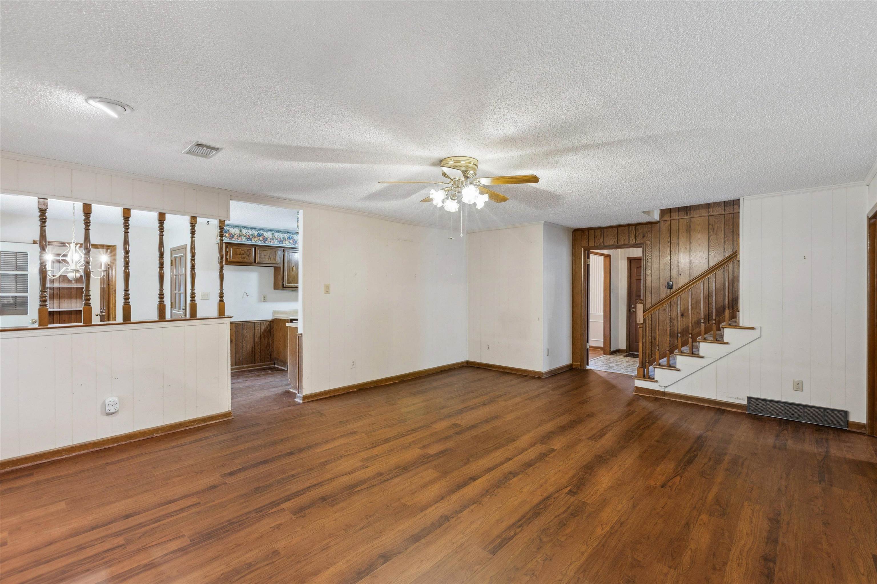 5973 Explorer Road Bartlett, TN 38134 - Photo 7 of 35 a view of an empty room with wooden floor and a window