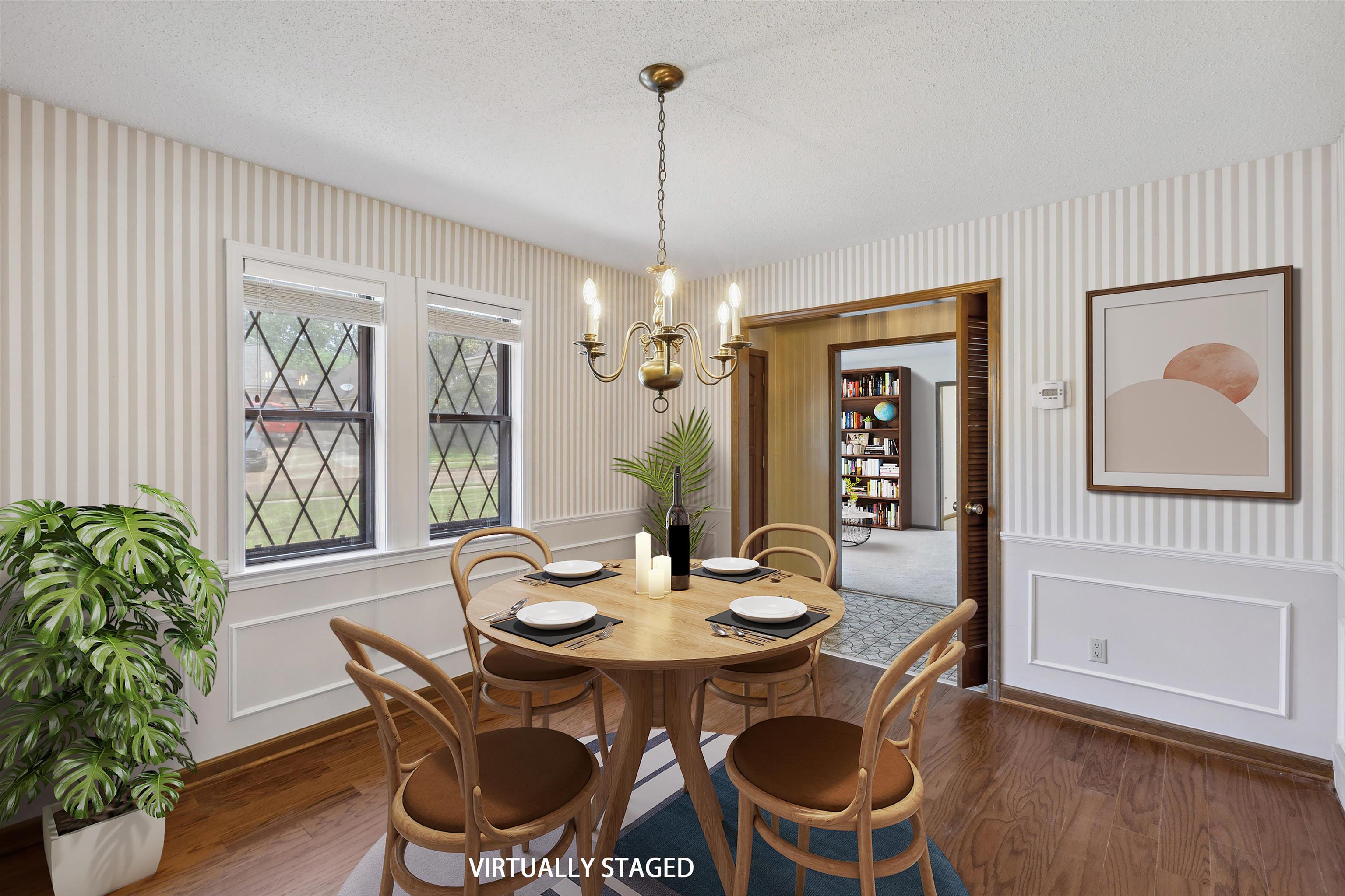 5973 Explorer Road Bartlett, TN 38134 - Photo 8 of 35 a dining room with furniture a window and wooden floor