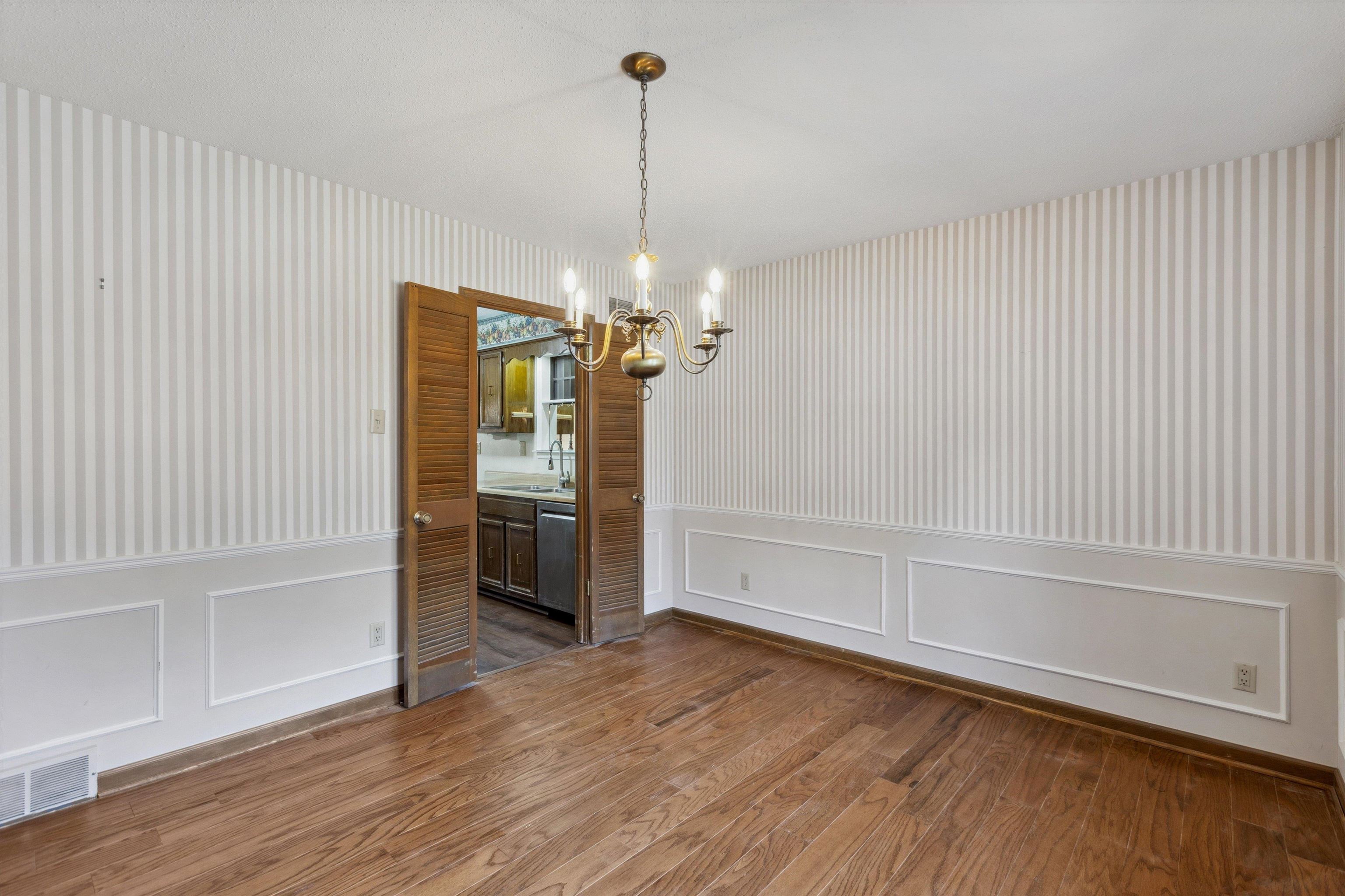 5973 Explorer Road Bartlett, TN 38134 - Photo 10 of 35 wooden floor in an empty room with a window