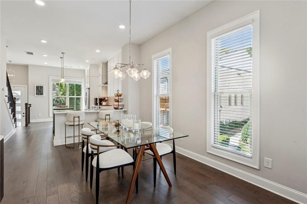 4219 Deming Circle Sandy Springs, GA 30342 - Photo 11 of 47 a view of a dining room with furniture and wooden floor