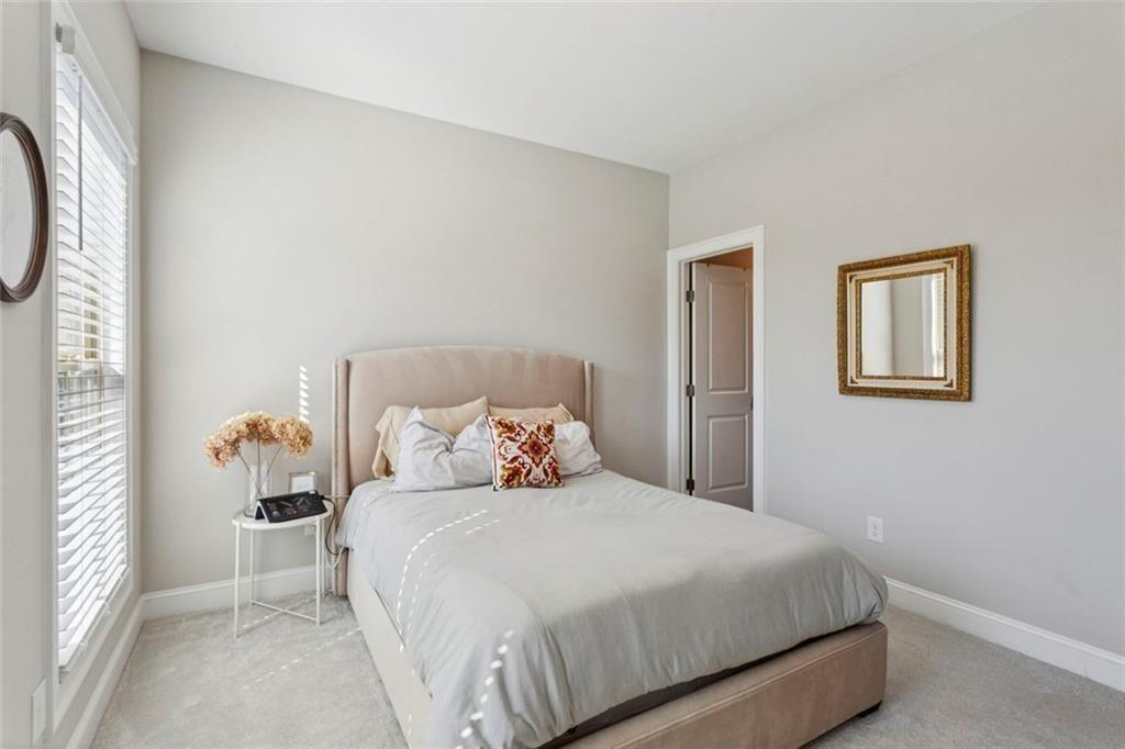 4219 Deming Circle Sandy Springs, GA 30342 - Photo 34 of 47 a bedroom with a bed and a window