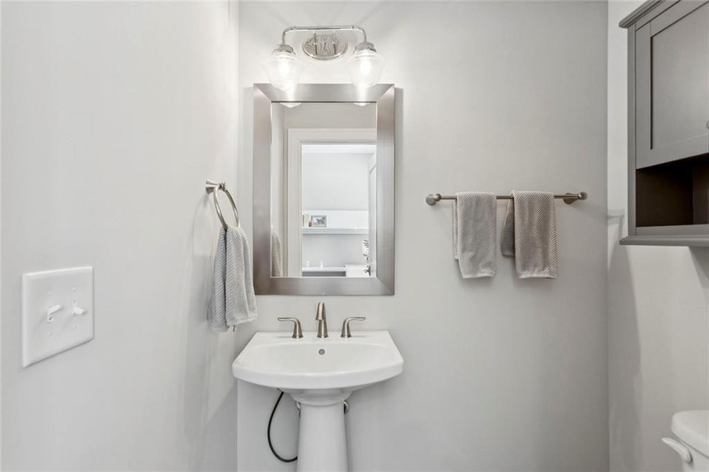 4219 Deming Circle Sandy Springs, GA 30342 - Photo 41 of 47 a bathroom with a sink and a mirror