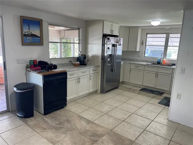 a kitchen with a cabinets and window