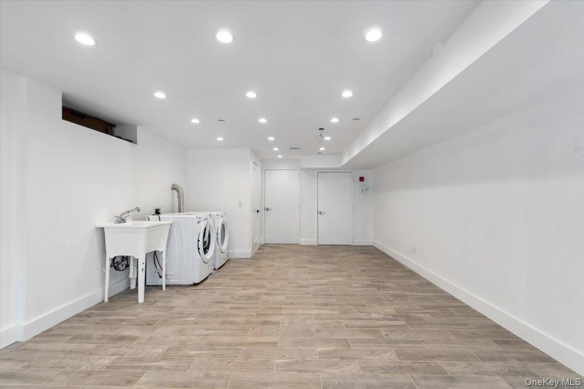 953 Tilden Street Bronx, NY 10469 - Photo 16 of 24 a view of a kitchen with a sink and a refrigerator