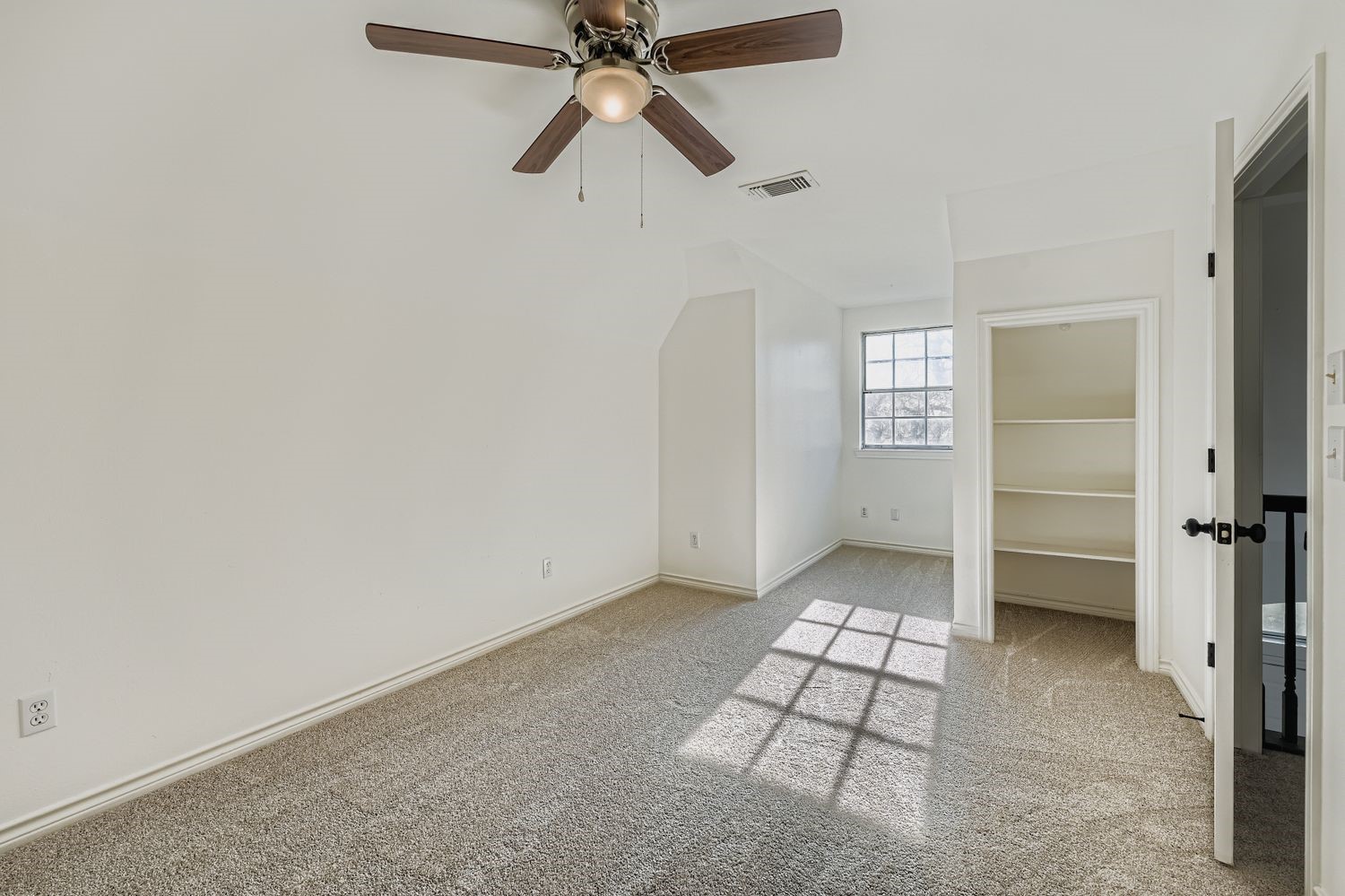 34411 Fulshear Farms Road Fulshear, TX 77441 - Photo 24 of 29 an empty room with windows and fan