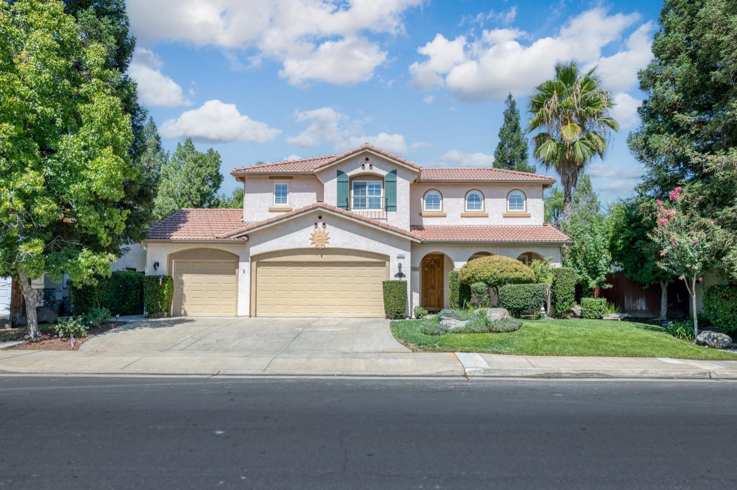 front view of a house with a garden
