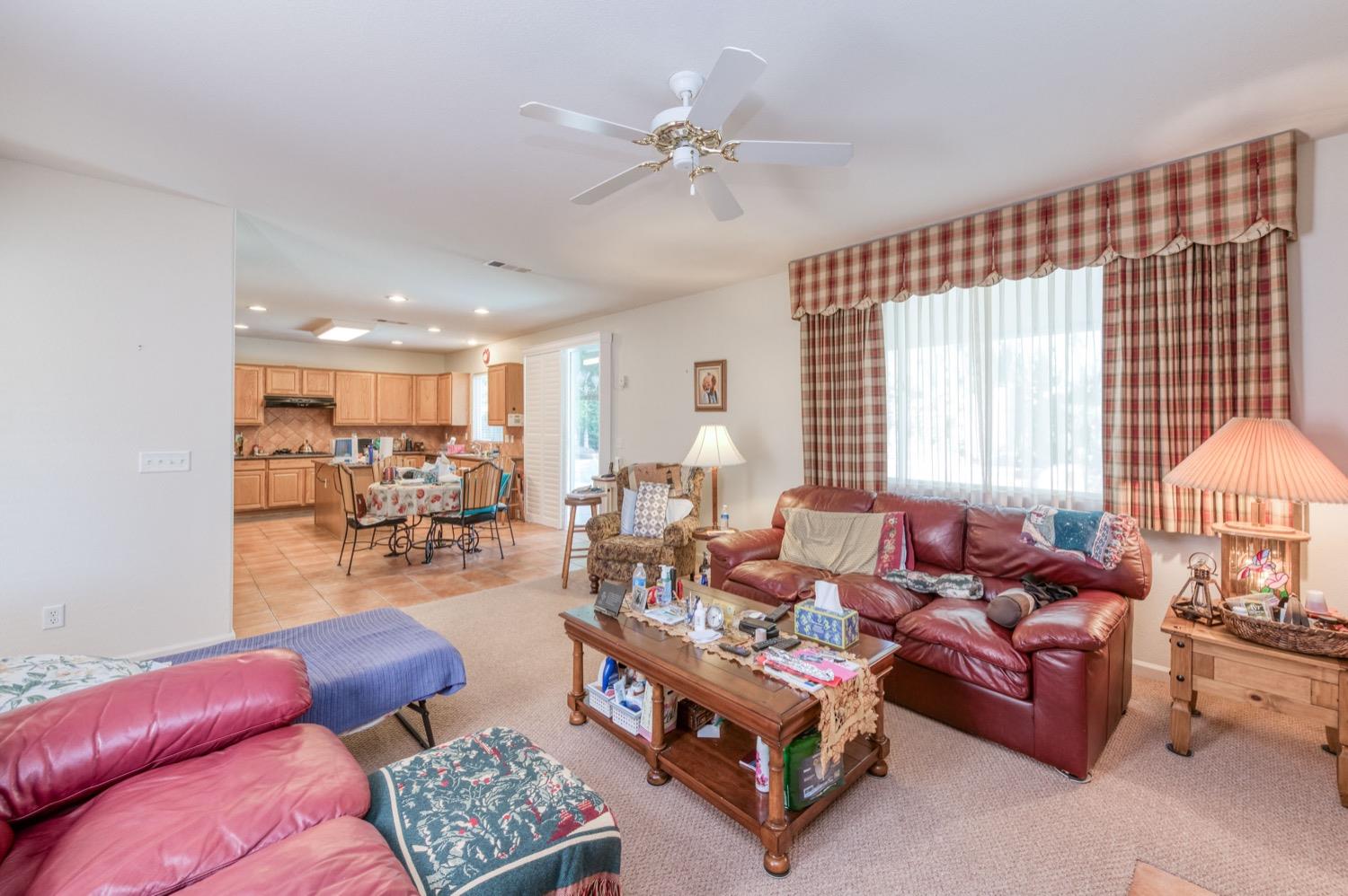 2661 Buckingham Avenue Clovis, CA 93611 - Photo 11 of 50 a living room with furniture and a large window
