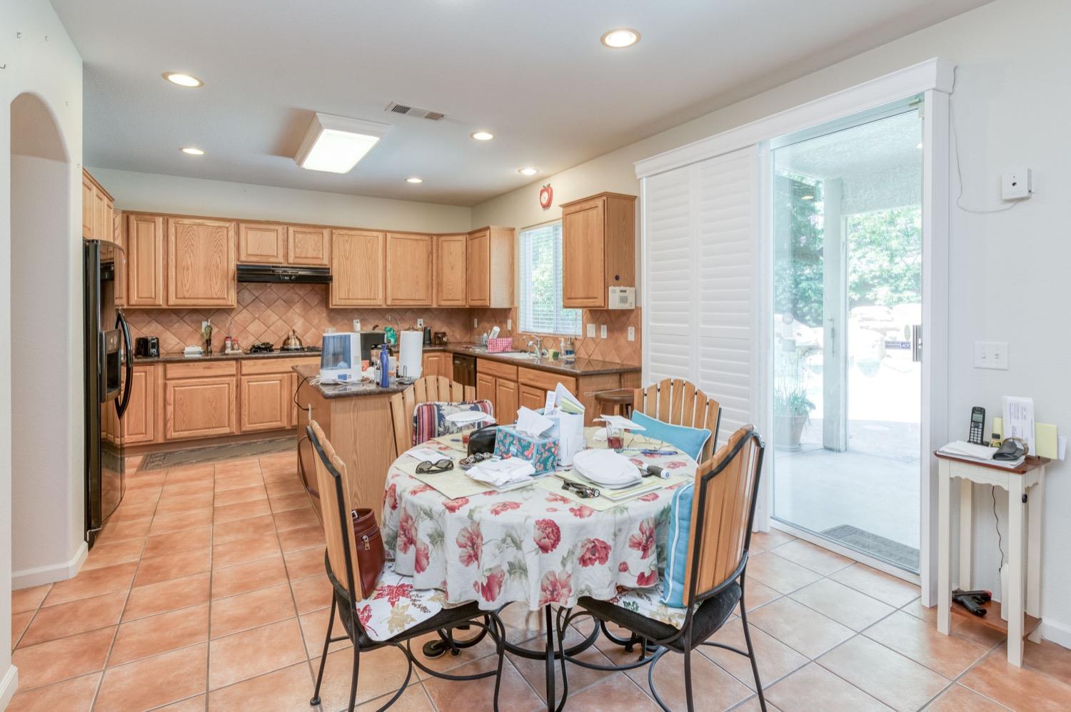 2661 Buckingham Avenue Clovis, CA 93611 - Photo 12 of 50 a dining room with furniture and a view of kitchen