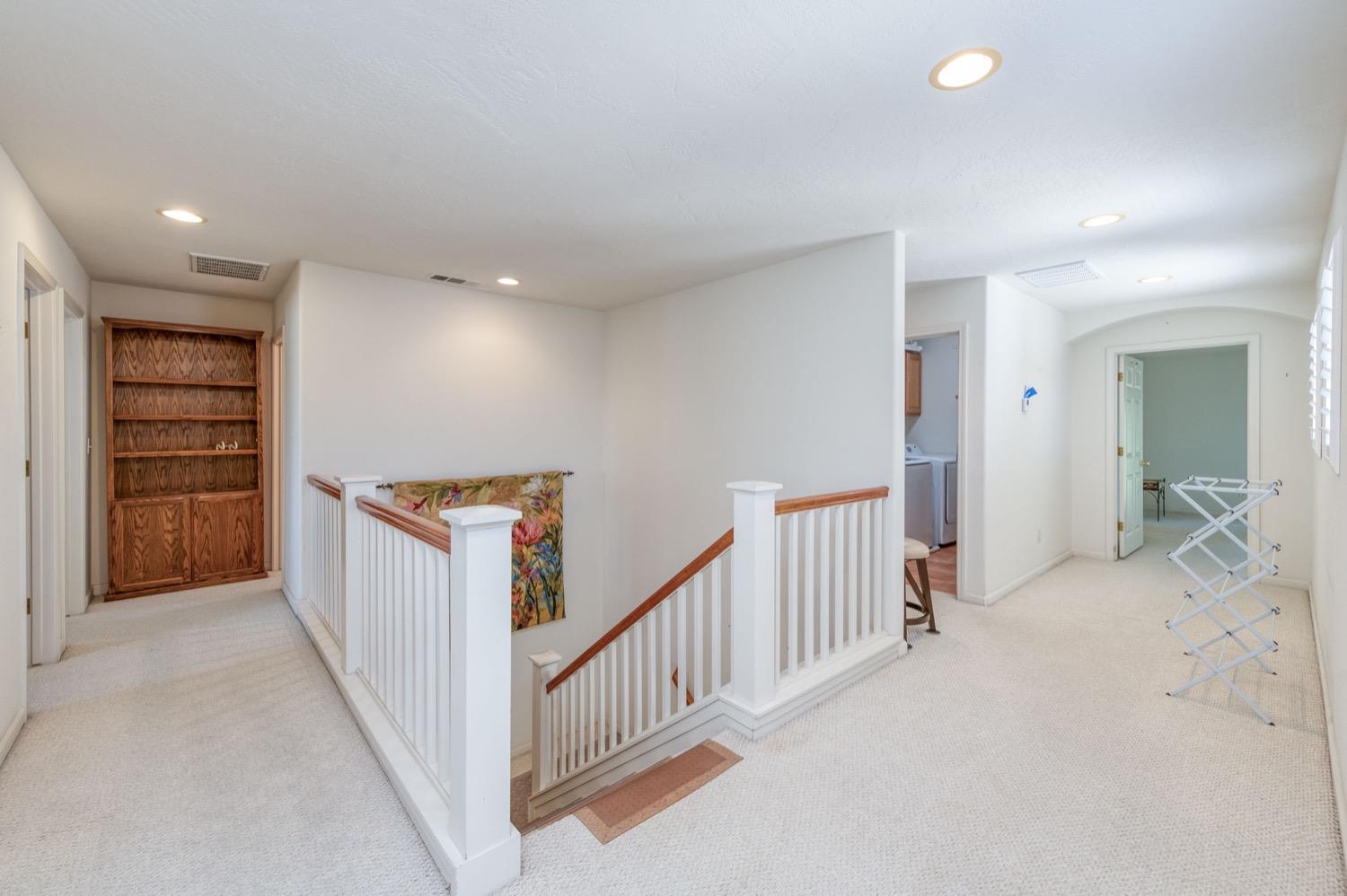 2661 Buckingham Avenue Clovis, CA 93611 - Photo 22 of 50 a view of a hallway with workspace