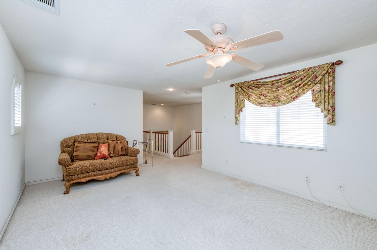 2661 Buckingham Avenue Clovis, CA 93611 - Photo 25 of 50 a living room with furniture and a window