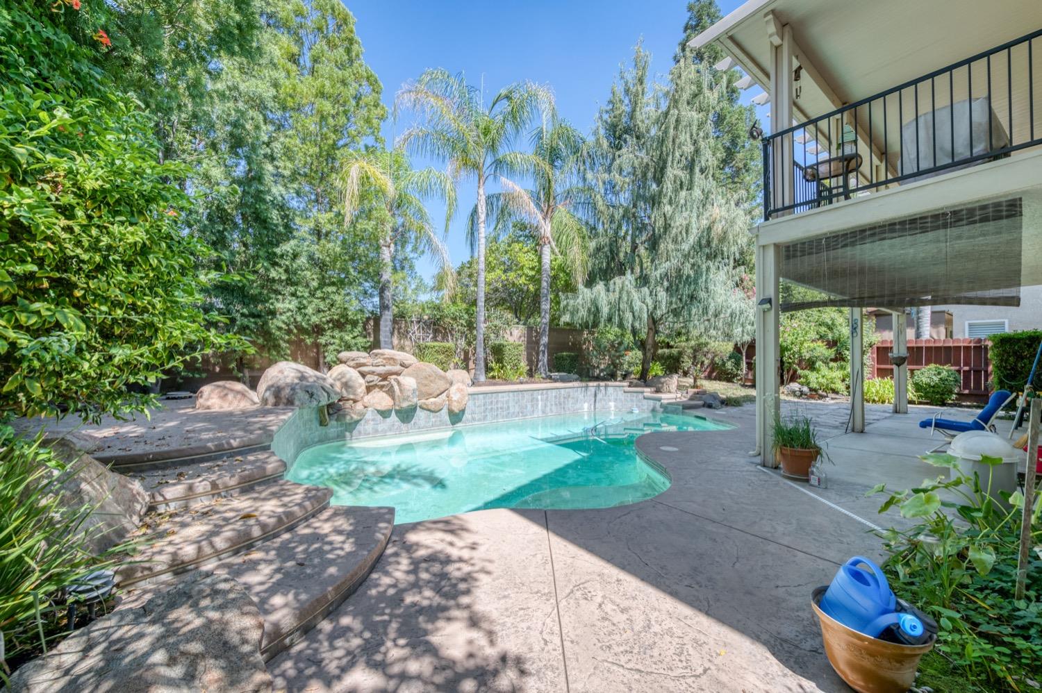 2661 Buckingham Avenue Clovis, CA 93611 - Photo 45 of 50 a view of a chair and tables in the patio