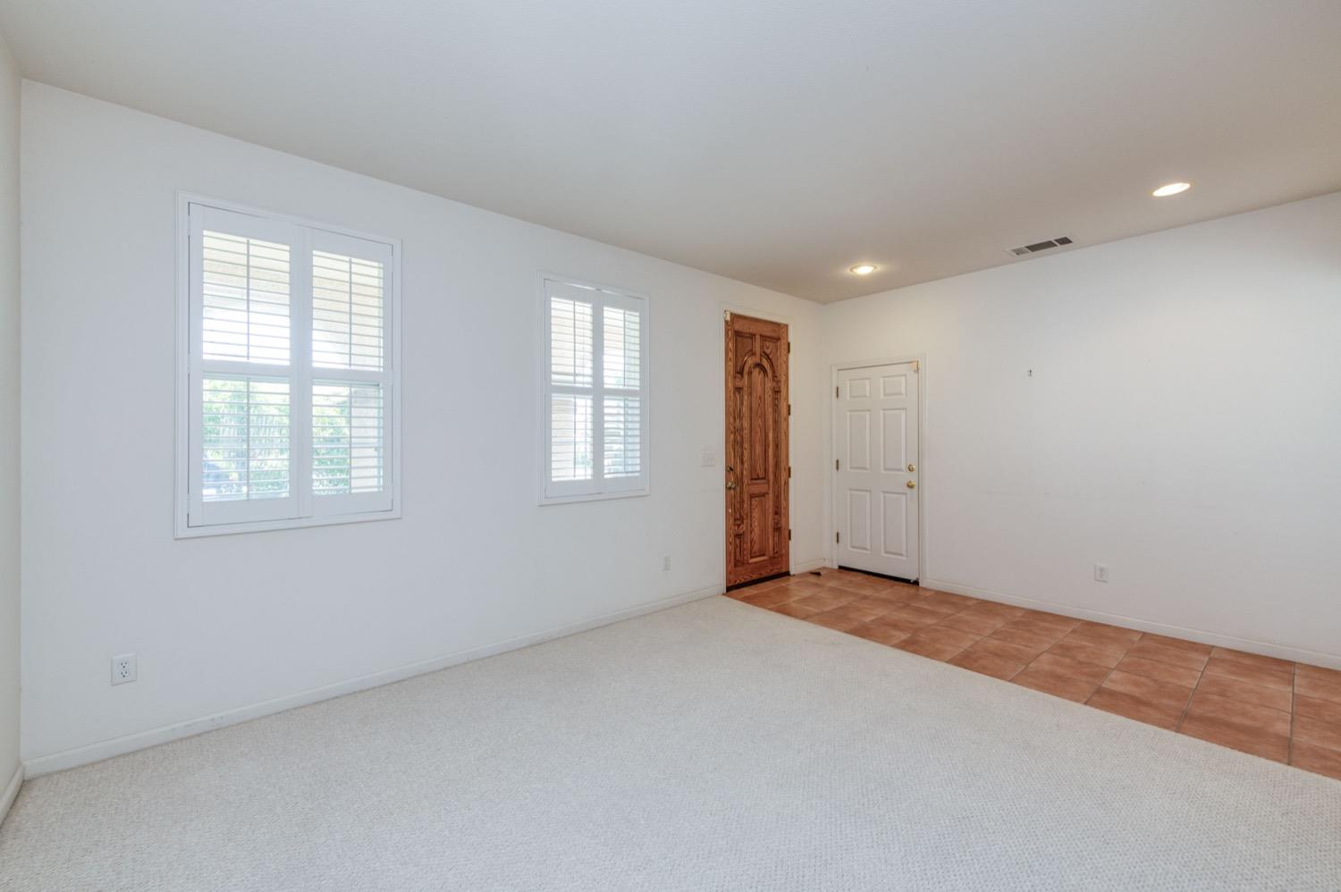 2661 Buckingham Avenue Clovis, CA 93611 - Photo 5 of 50 an empty room with windows