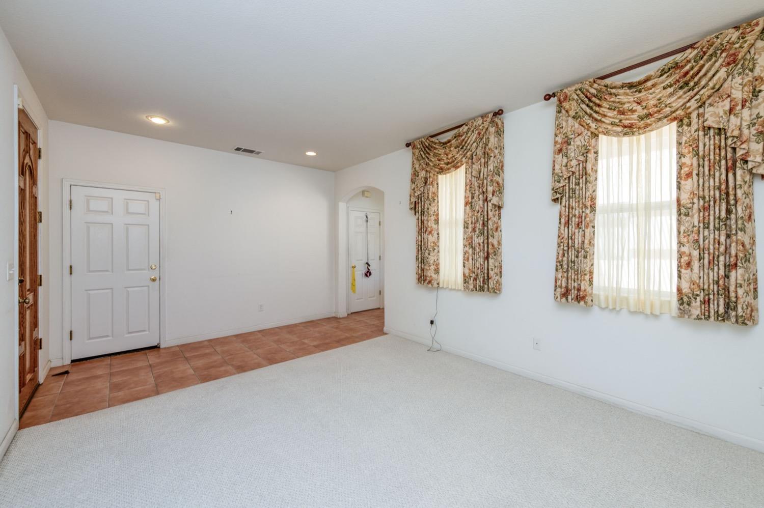 2661 Buckingham Avenue Clovis, CA 93611 - Photo 6 of 50 a view of an empty room with a window