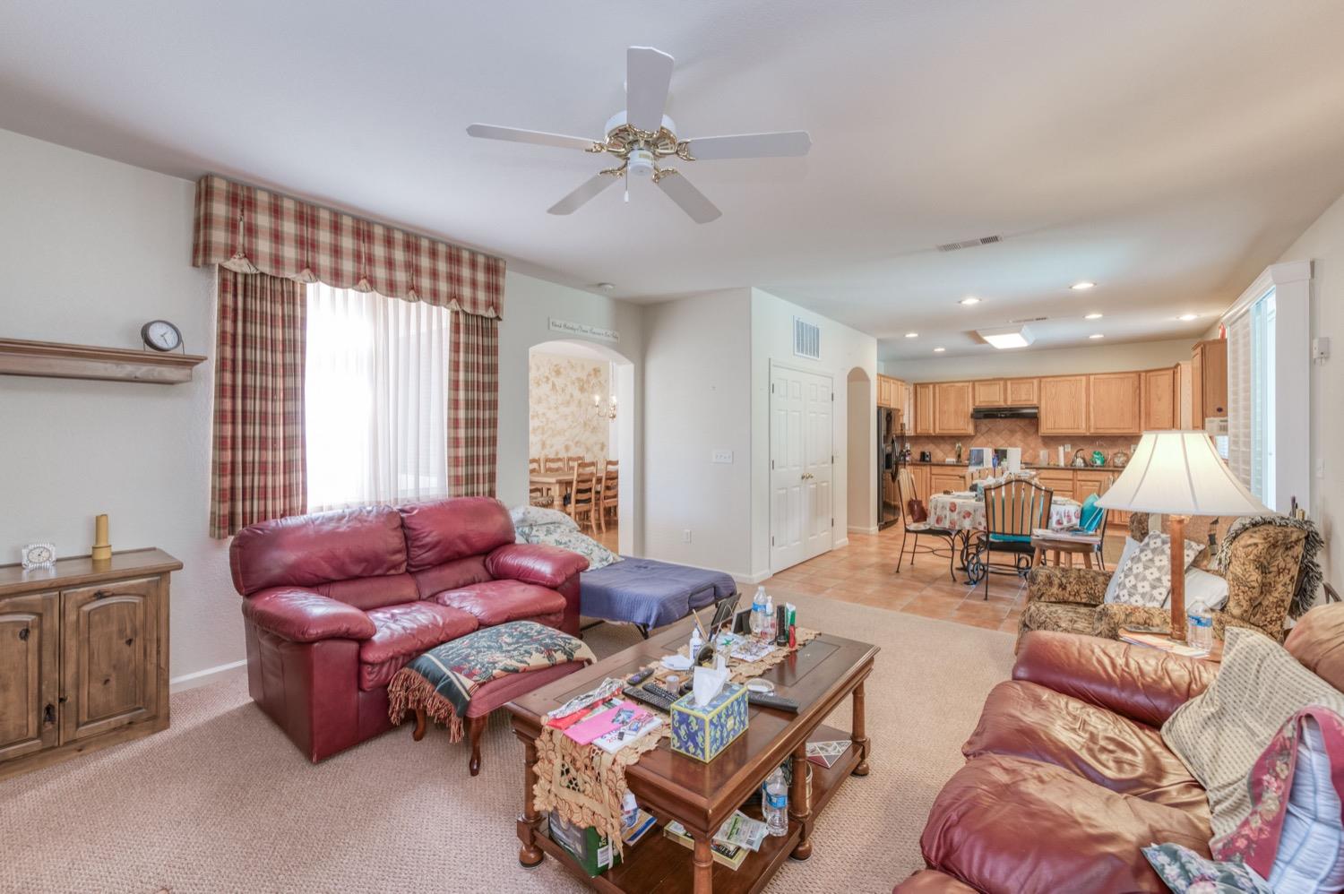2661 Buckingham Avenue Clovis, CA 93611 - Photo 10 of 50 a living room with furniture and a large window