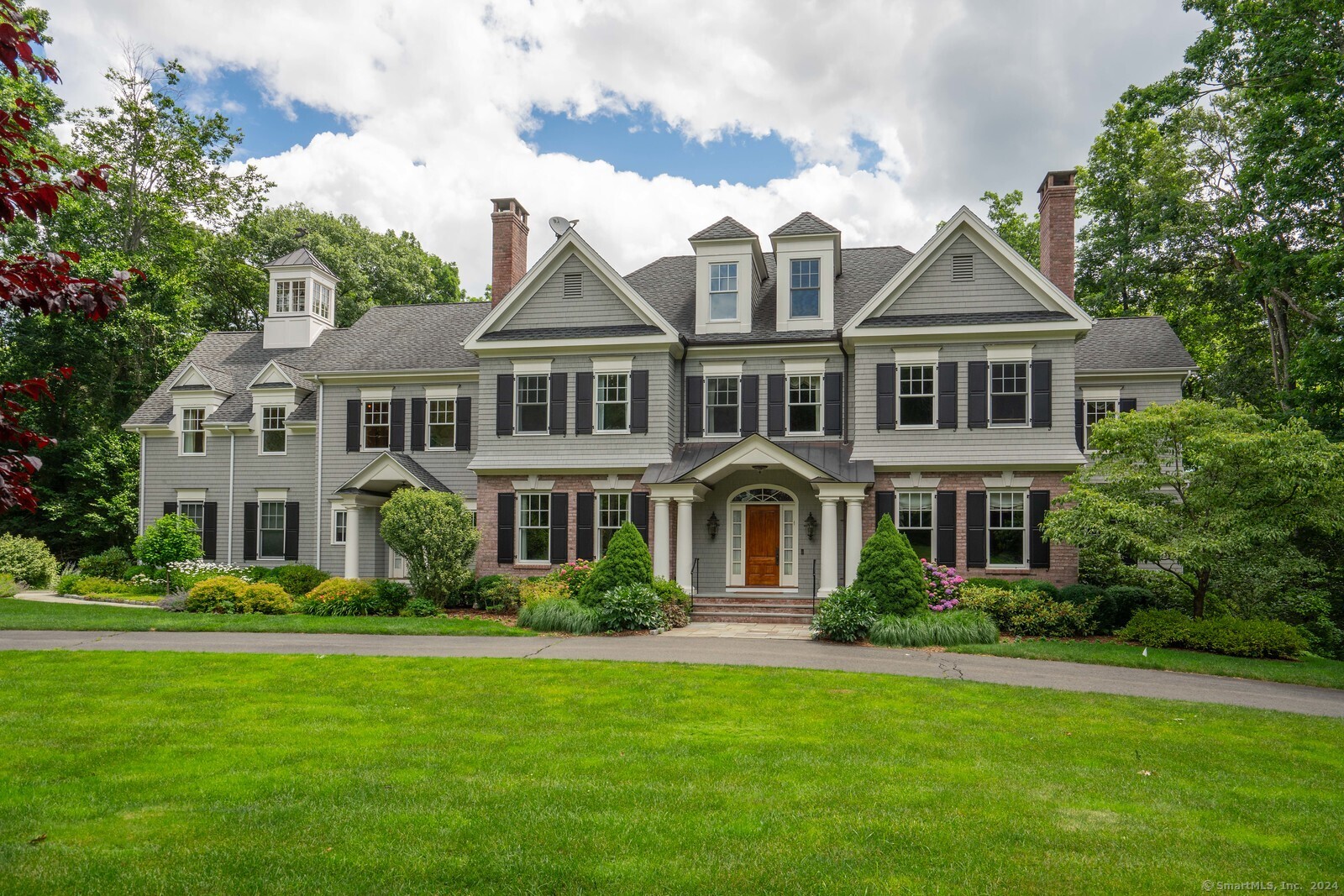 110 Sunset Farm Road West Hartford, CT 06107 - Photo 1 of 1 a front view of a house with a garden