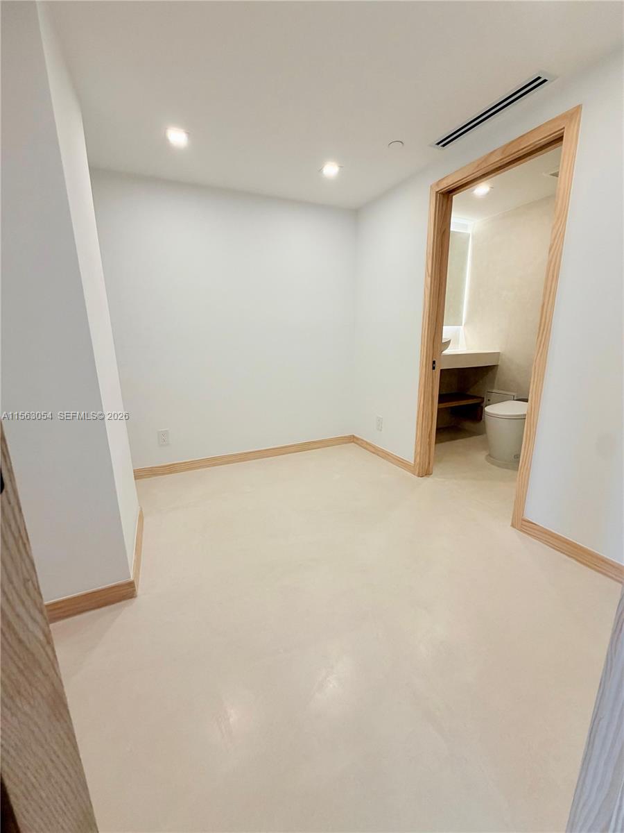 100 Lincoln Road, Unit 1241 Miami Beach, FL 33139 - Photo 7 of 18 wooden floor in an empty room with a window