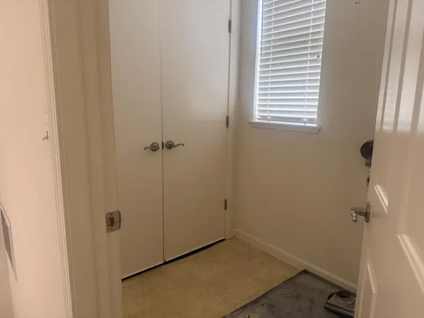 a view of a hallway with closet