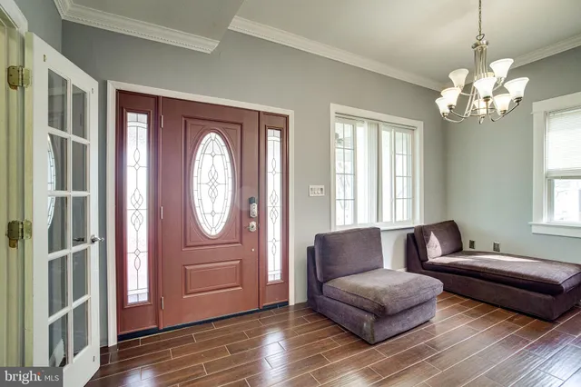 a bedroom with a bed and a dresser in it
