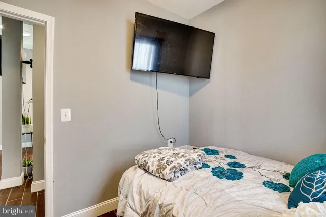 a large kitchen with stainless steel appliances granite countertop a sink dishwasher a stove and wooden floor