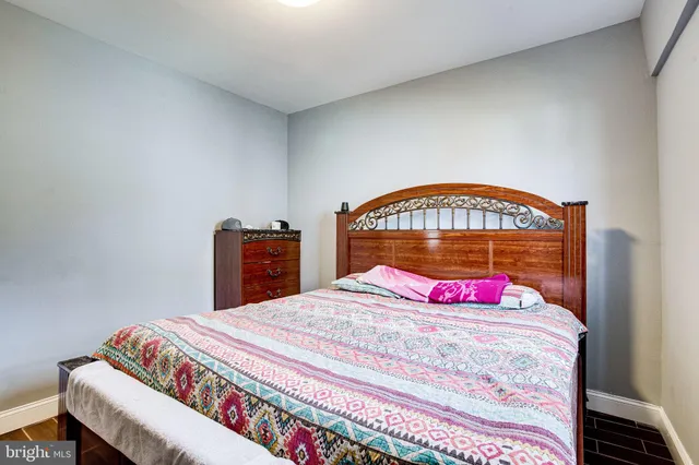 a kitchen with stainless steel appliances granite countertop a stove a sink dishwasher and cabinets with wooden floor