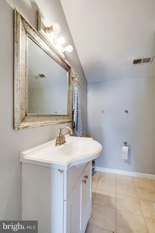 a view of a backyard with chairs and a small cabin