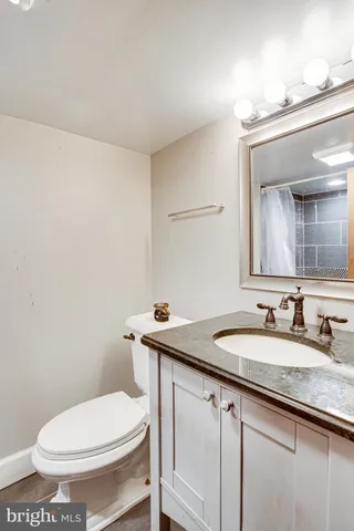 a kitchen with a sink cabinets stainless steel appliances and a window