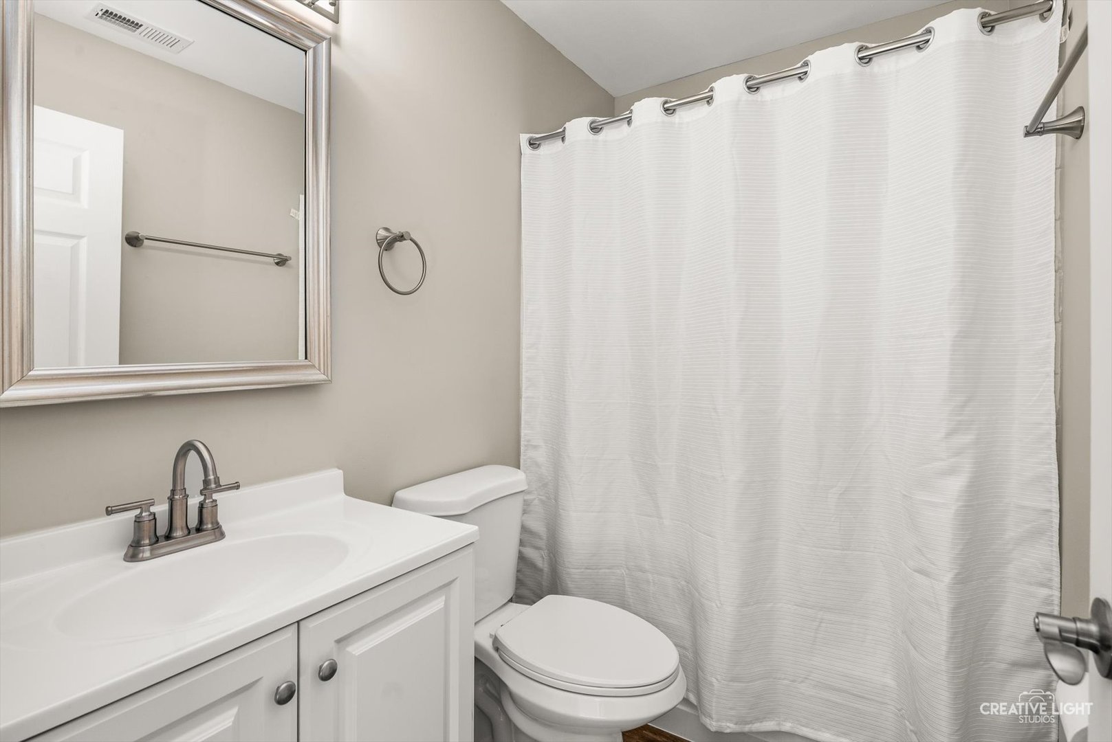 308 Alyssa Street Plano, IL 60545 - Photo 7 of 10 a bathroom with a sink a toilet and shower