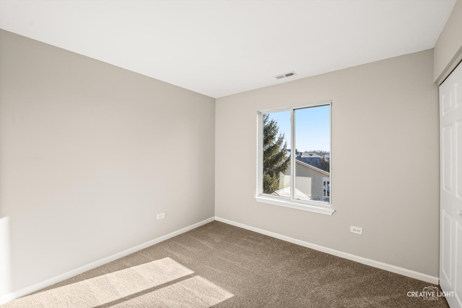 308 Alyssa Street Plano, IL 60545 - Photo 6 of 10 a view of an empty room with a window