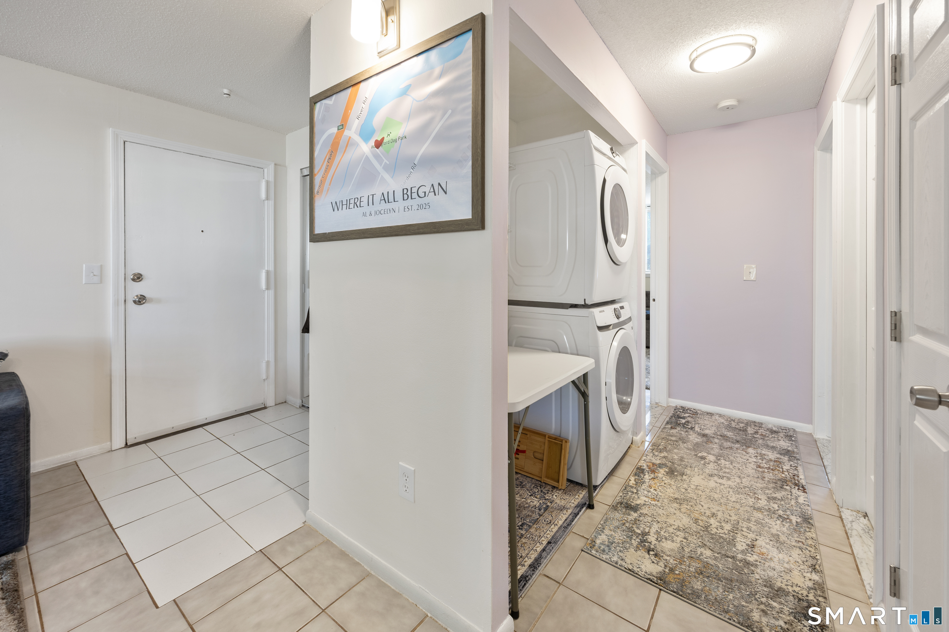 560 Yale Avenue, Unit 82 Meriden, CT 06450 - Photo 12 of 22 a view of hallway with washer and dryer